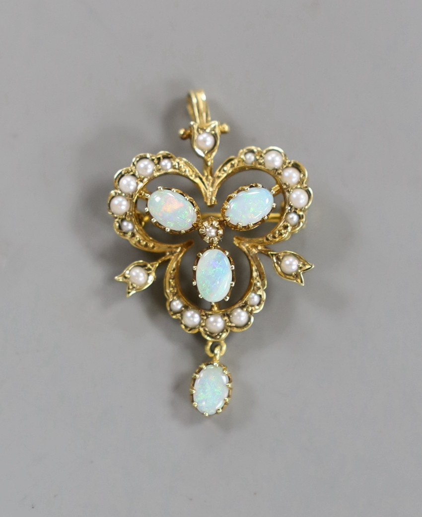 An Edwardian style 9ct gold, white opal and seed pearl set drop pendant brooch, overall 39mm, gross weight 4.9 grams.
